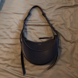 Polène Paris Numéro Dix: EDITION SMOOTH BLACK Bag (black with white stitching)